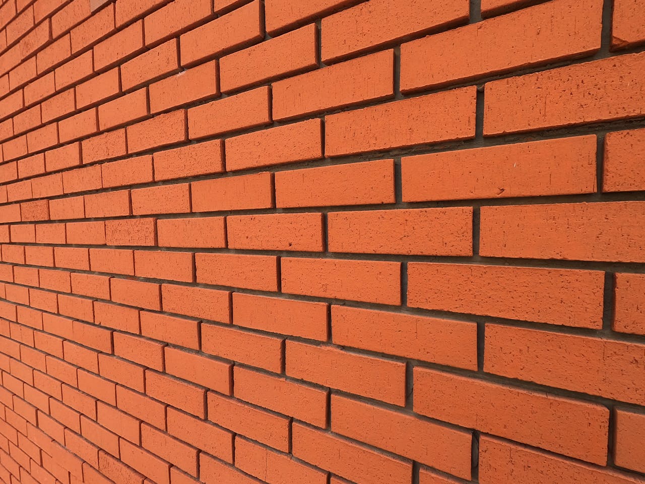 gallery-5 Detailed texture of a red brick wall for background and design use.